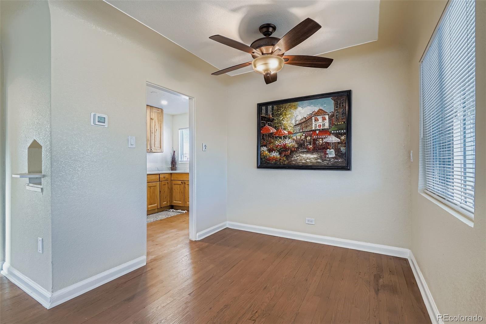 680 Irving Street Denver, CO 80204 - Photo 12 of 33 an empty room with wooden floor and windows