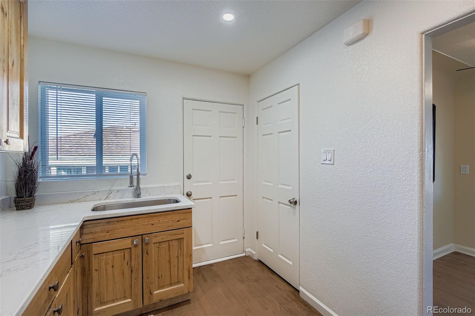 680 Irving Street Denver, CO 80204 - Photo 15 of 33 a bathroom with a sink and a mirror