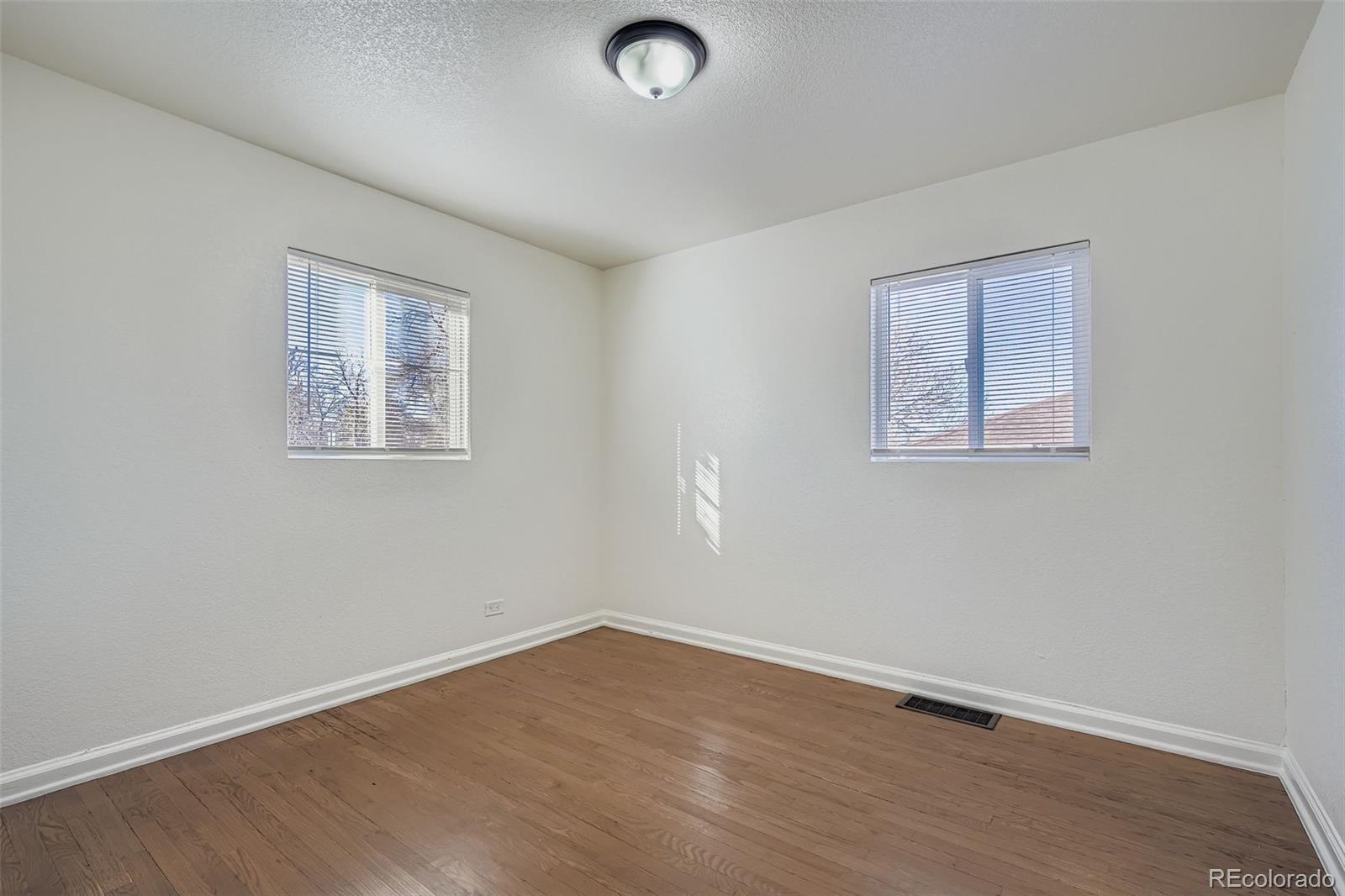 680 Irving Street Denver, CO 80204 - Photo 16 of 33 an empty room with a workspace
