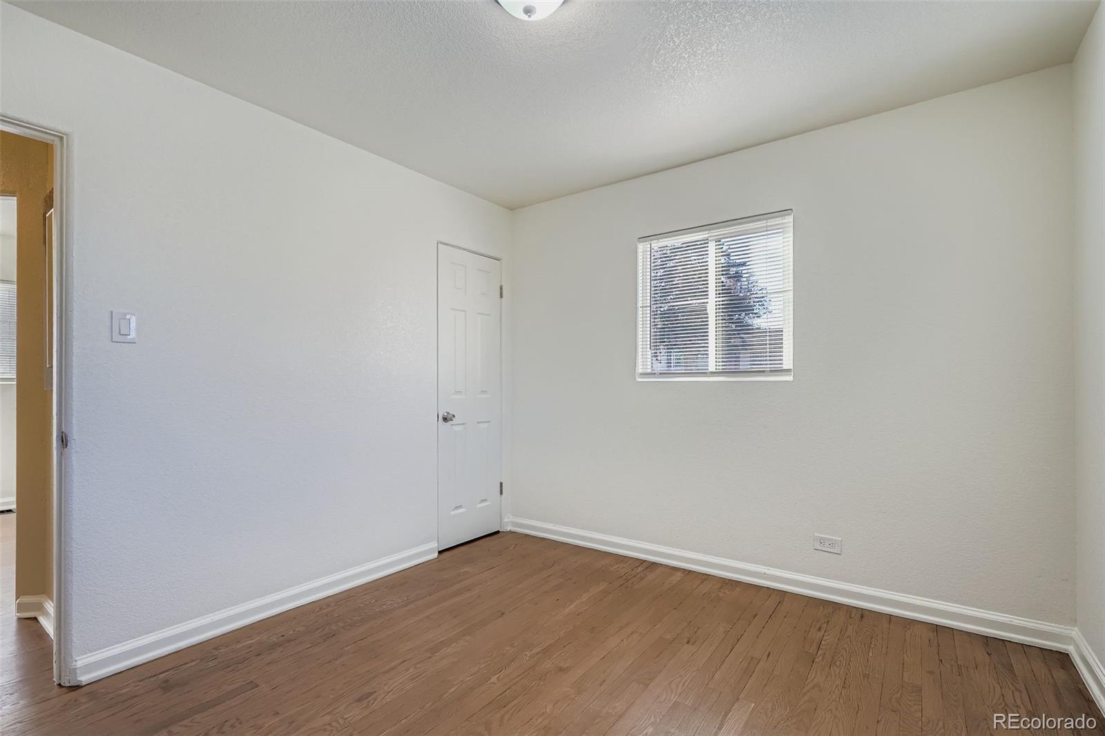 680 Irving Street Denver, CO 80204 - Photo 17 of 33 an empty room with a window