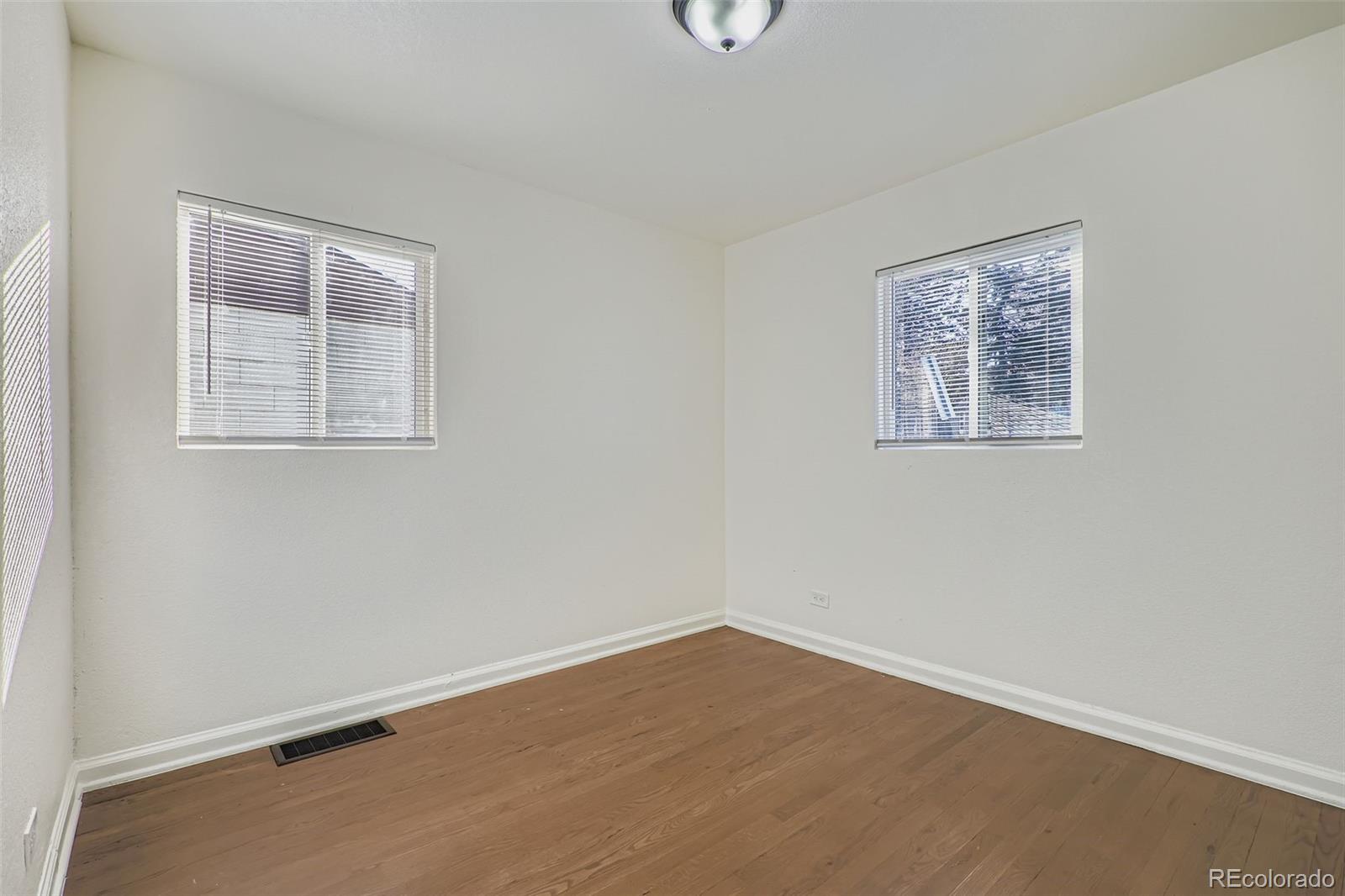 680 Irving Street Denver, CO 80204 - Photo 19 of 33 an empty room with a workbench