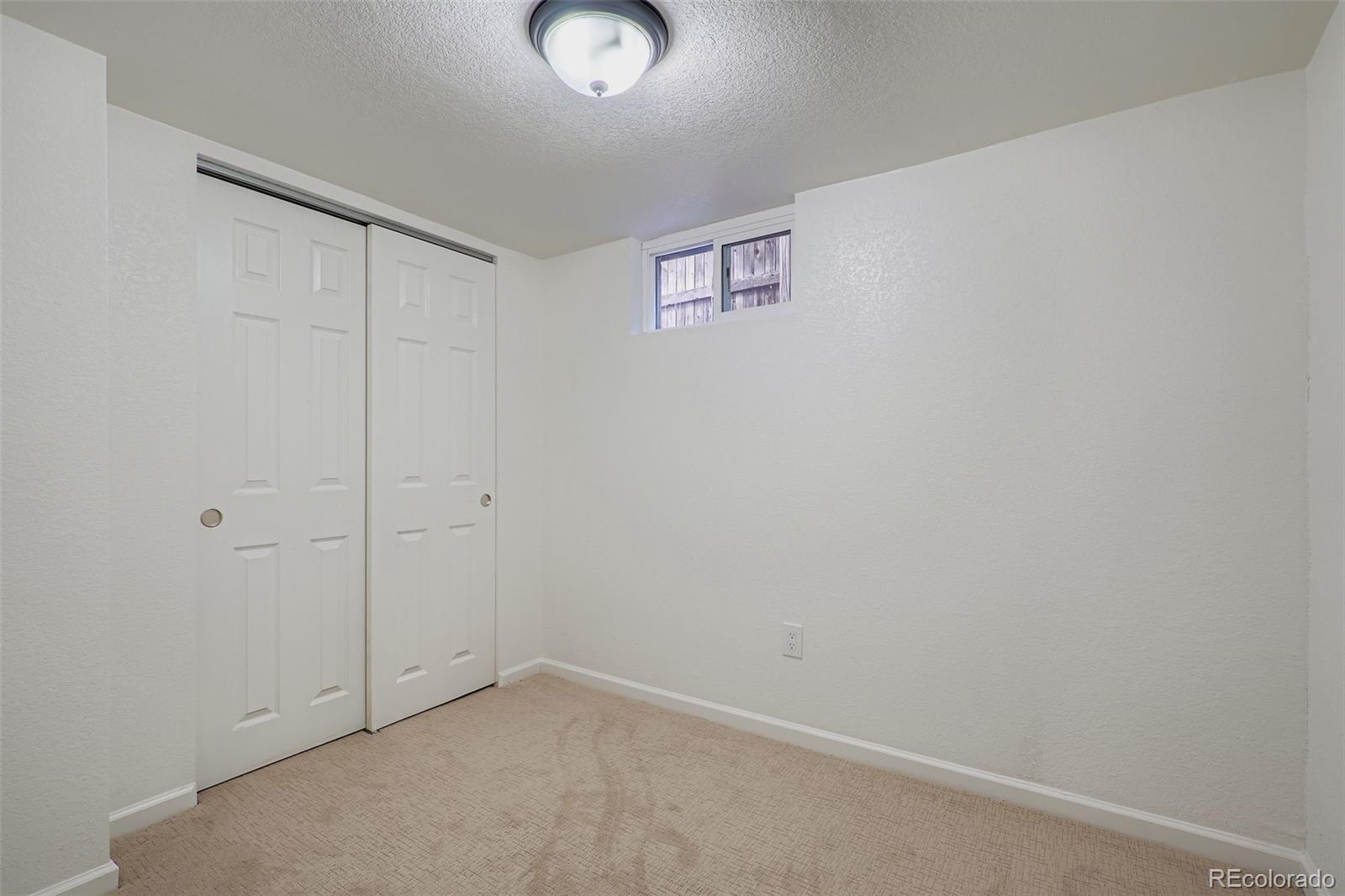 680 Irving Street Denver, CO 80204 - Photo 25 of 33 an empty room with windows