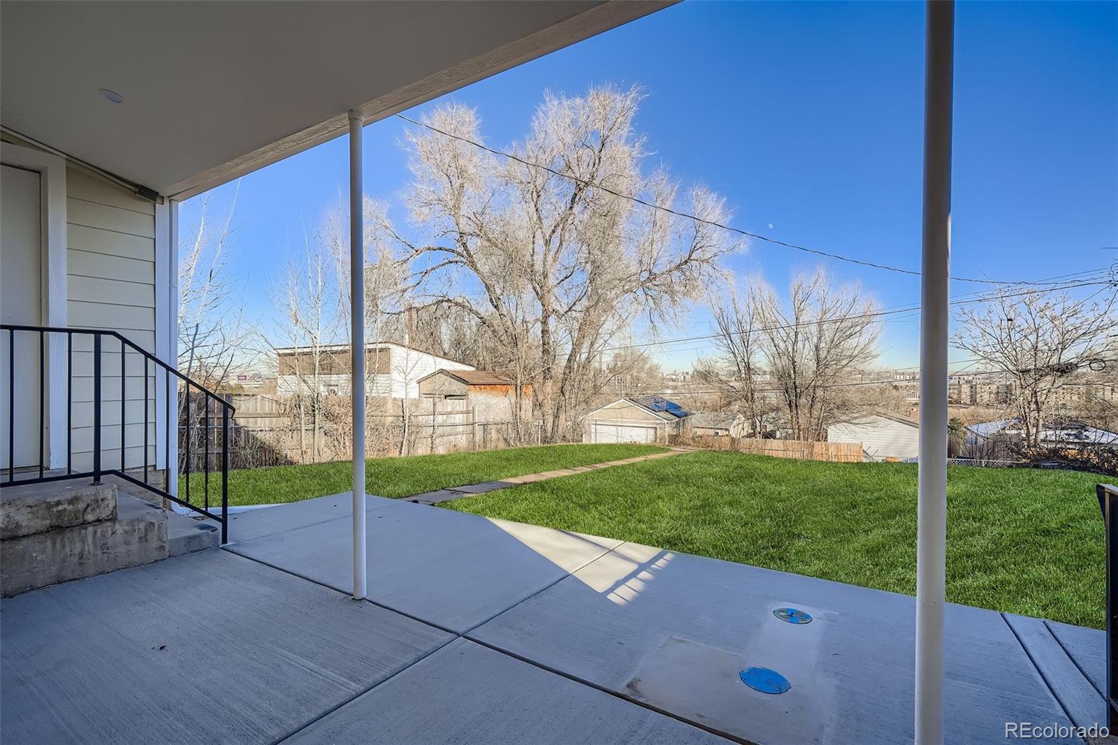 680 Irving Street Denver, CO 80204 - Photo 28 of 33 a view of a house with backyard and trees
