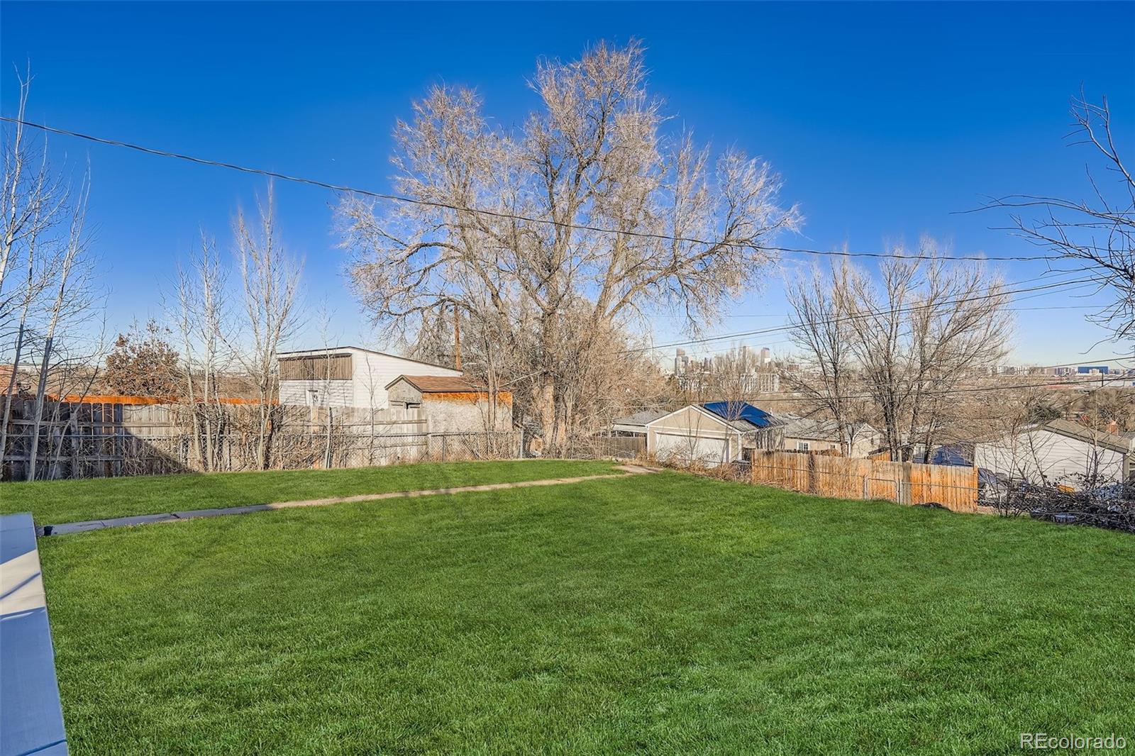 680 Irving Street Denver, CO 80204 - Photo 29 of 33 a view of a house with a yard