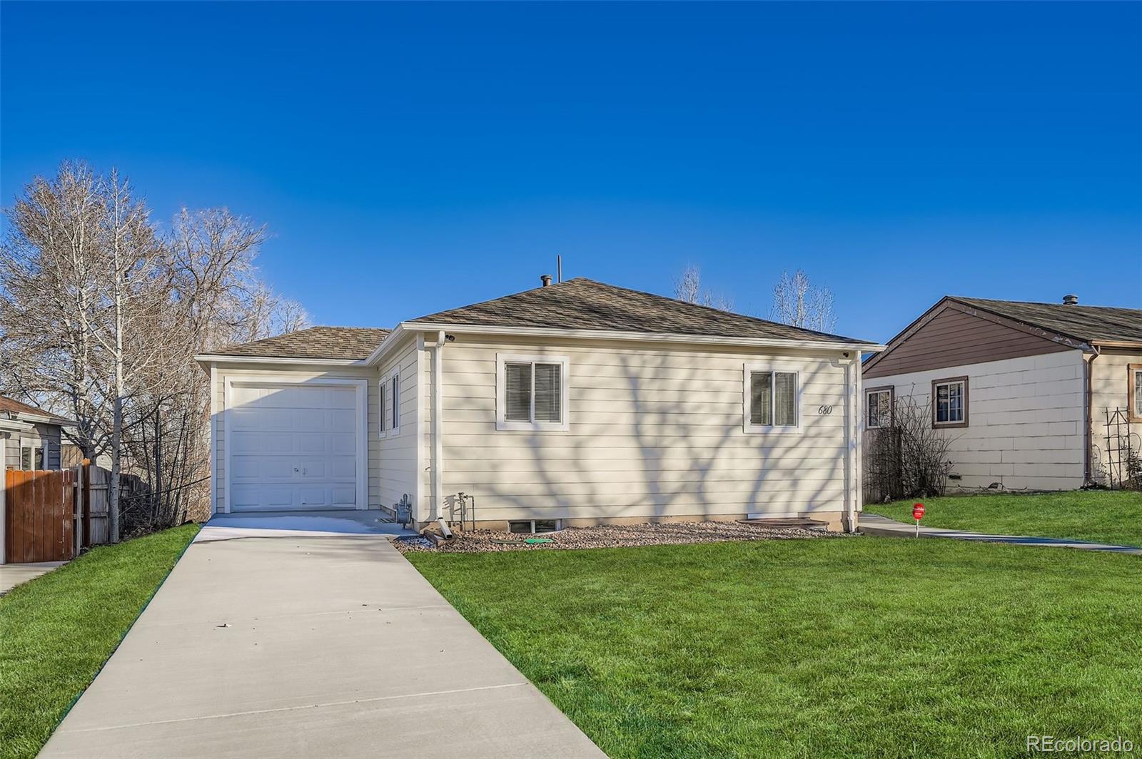 680 Irving Street Denver, CO 80204 - Photo 3 of 33 a front view of a house with garden