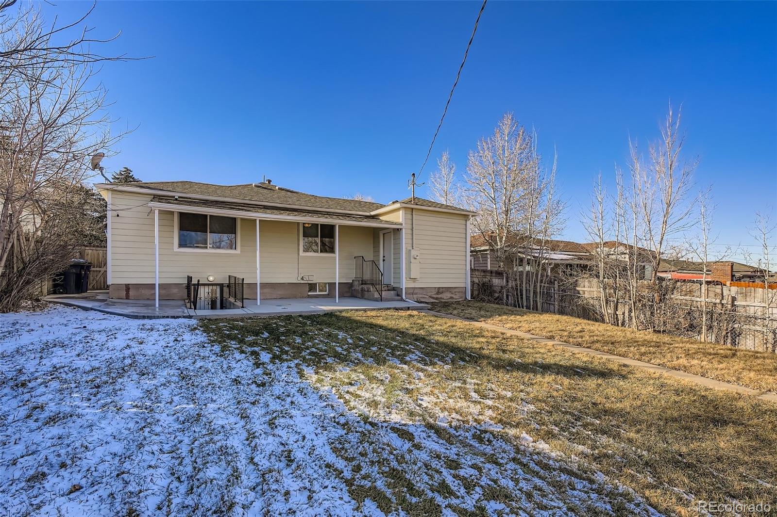 680 Irving Street Denver, CO 80204 - Photo 33 of 33 a view of a house with backyard and trees