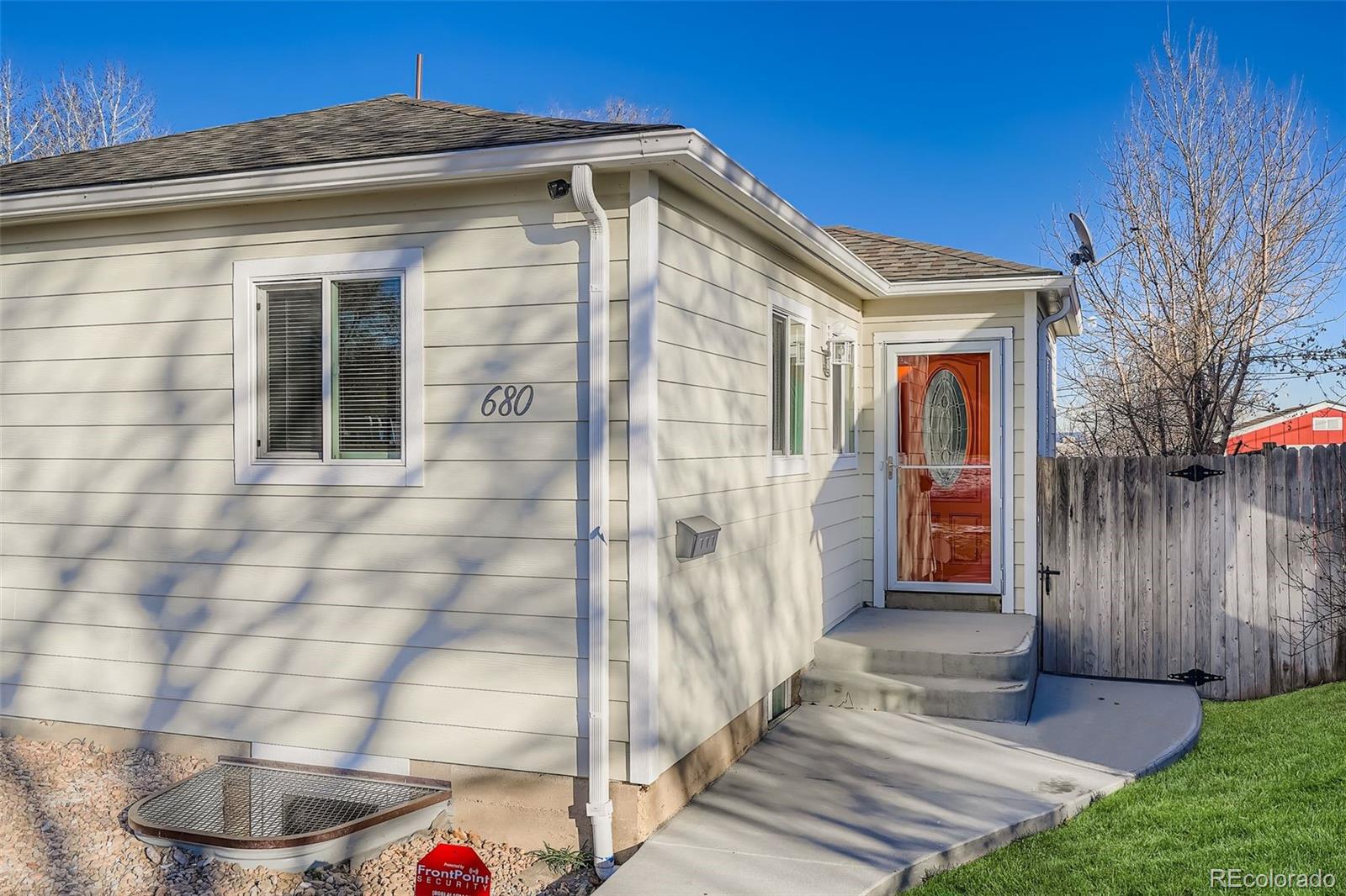 680 Irving Street Denver, CO 80204 - Photo 5 of 33 a front view of a house with a yard