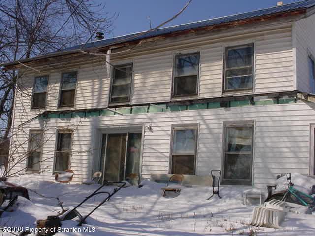 2295 Booth Road Hallstead, PA 18822 - Photo 1 of 6 a front view of a house with yard