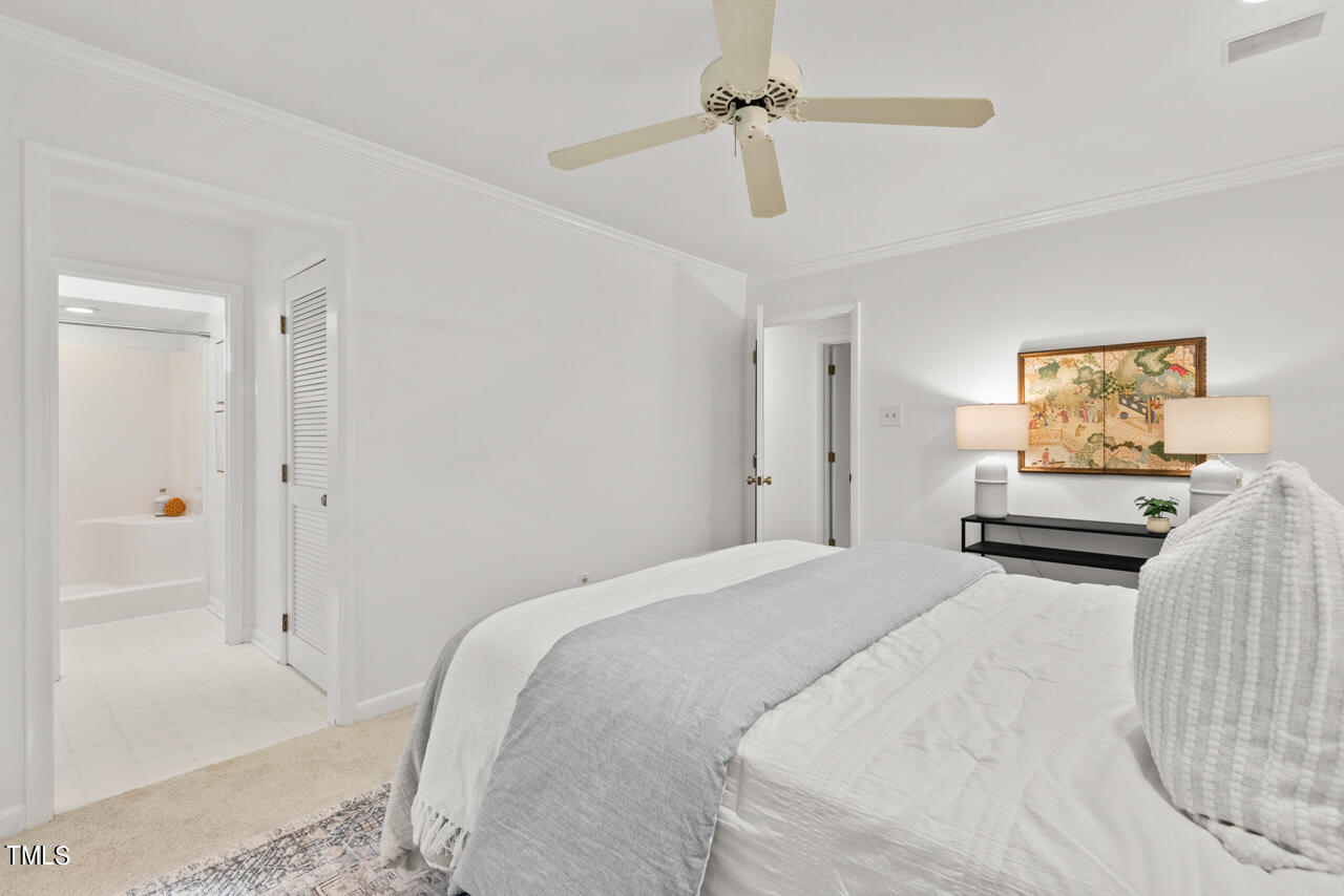 50 Stoneridge Road Durham, NC 27705 - Photo 30 of 40 a bedroom with a bed and a painting on the wall