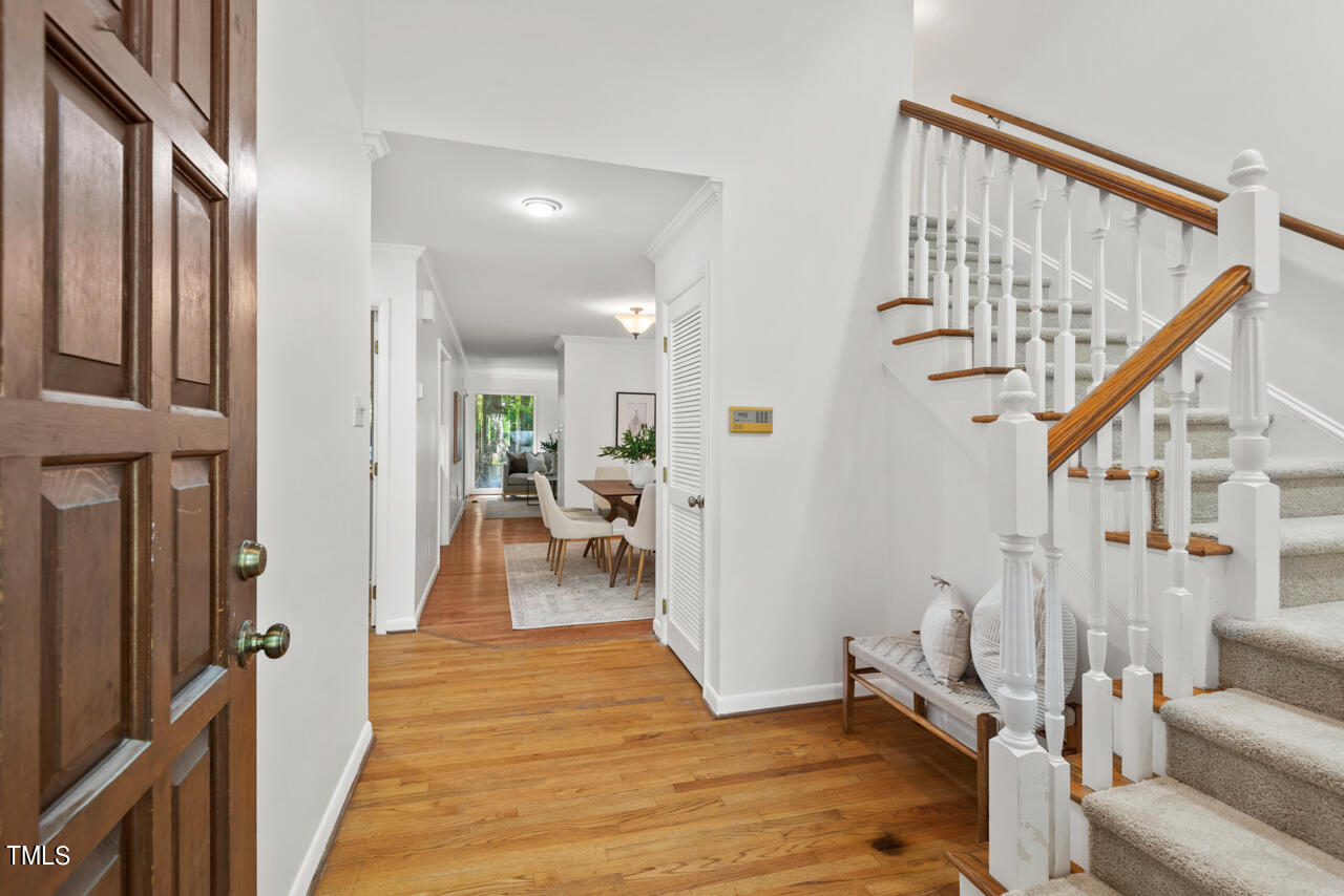 50 Stoneridge Road Durham, NC 27705 - Photo 3 of 40 a view of a hallway with wooden floor and staircase