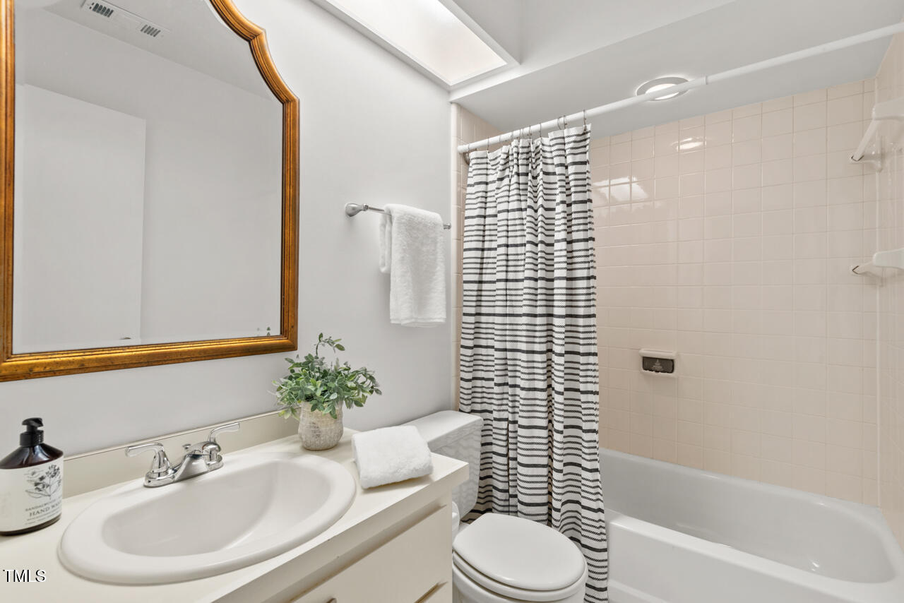 50 Stoneridge Road Durham, NC 27705 - Photo 34 of 40 a bathroom with a sink toilet and shower