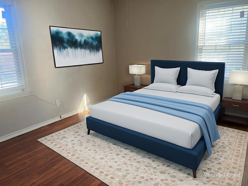 1721 Jocyle Street Arlington, TX 76010 - Photo 16 of 30 a bedroom with bed and wooden floor