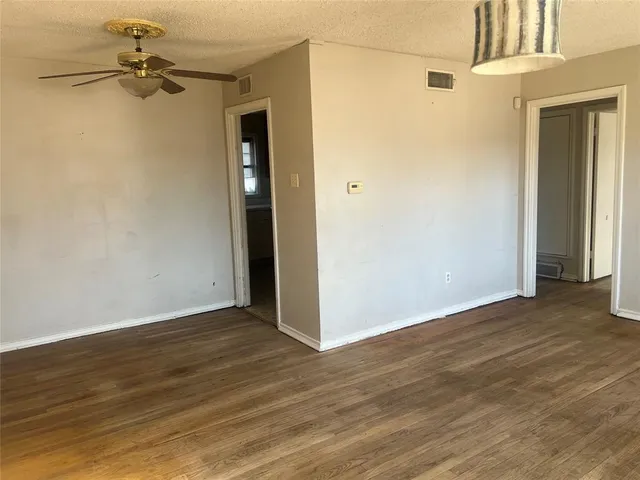 a living room with furniture a rug and a window