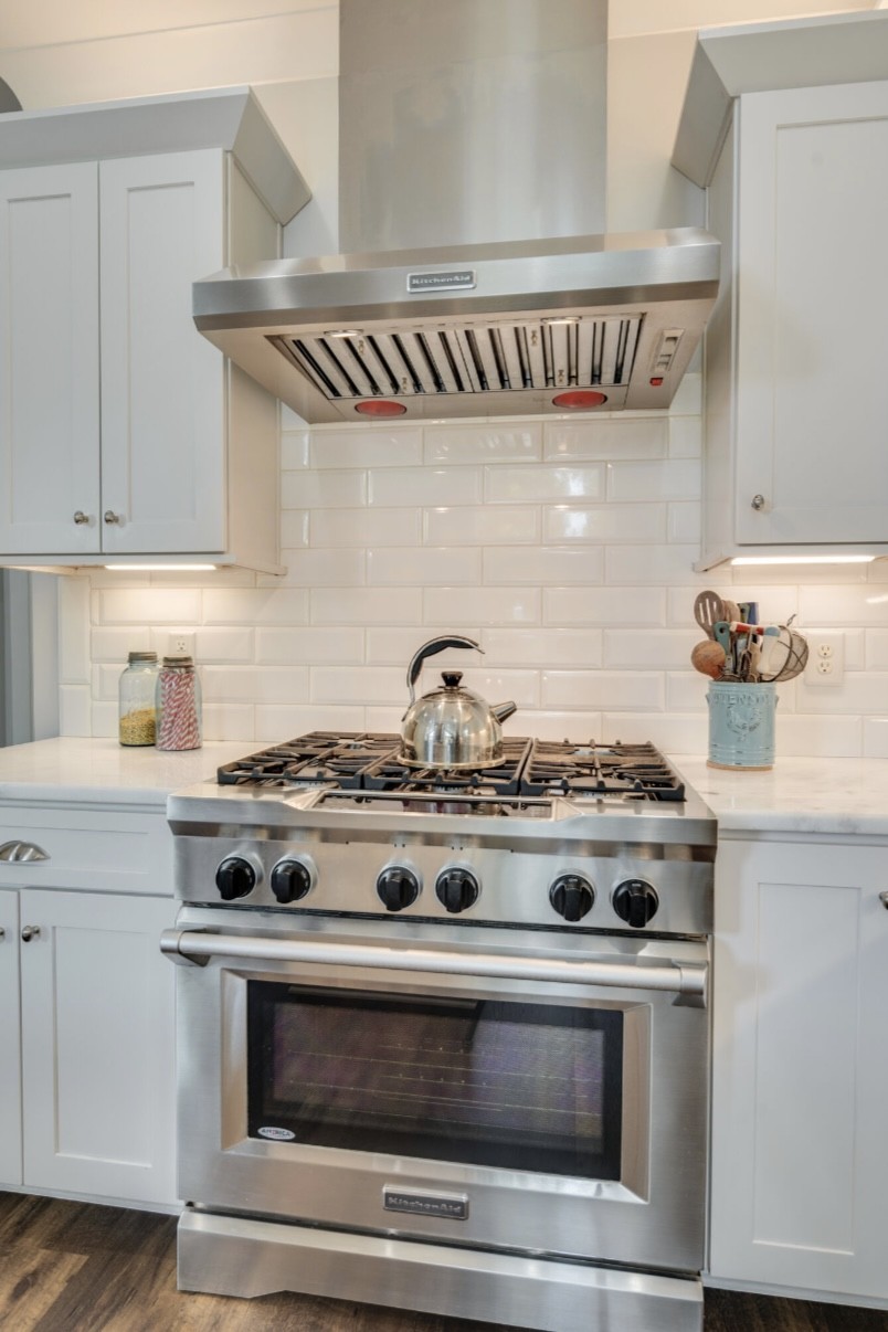5560 Pinewood Road Franklin, TN 37064 - Photo 12 of 43 a stove top oven sitting inside of a kitchen