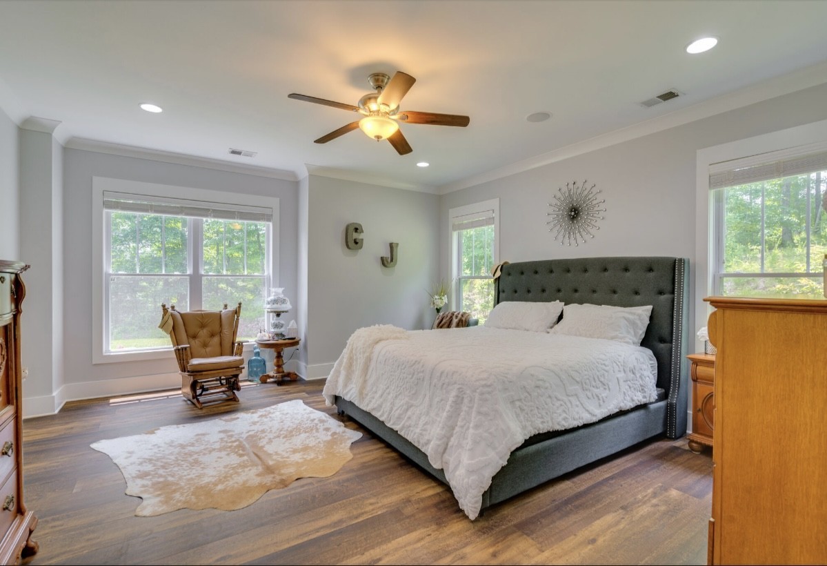 5560 Pinewood Road Franklin, TN 37064 - Photo 18 of 43 a bedroom with a bed and large windows