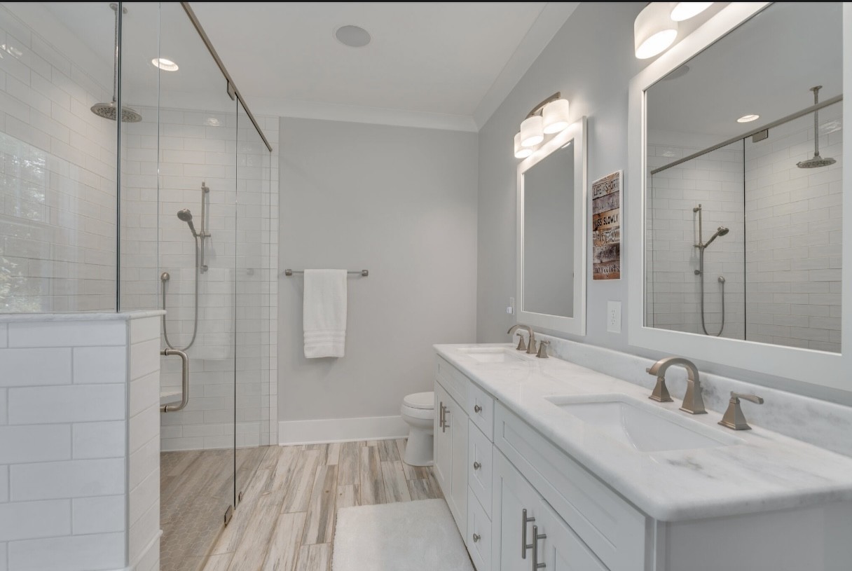 5560 Pinewood Road Franklin, TN 37064 - Photo 20 of 43 a bathroom with a double vanity sink mirror and shower