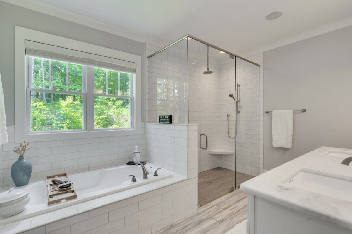 5560 Pinewood Road Franklin, TN 37064 - Photo 21 of 43 a bathroom with a tub a sink and a shower