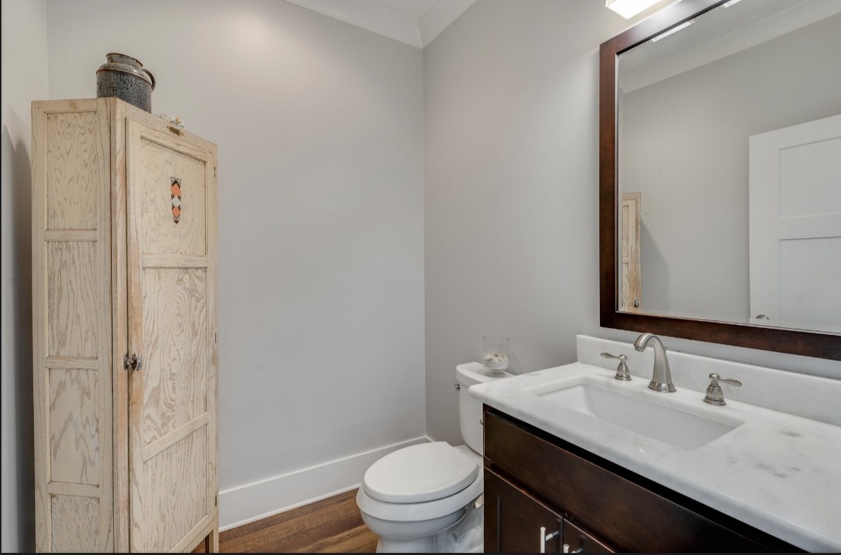 5560 Pinewood Road Franklin, TN 37064 - Photo 25 of 43 a bathroom with a granite countertop sink toilet and a mirror