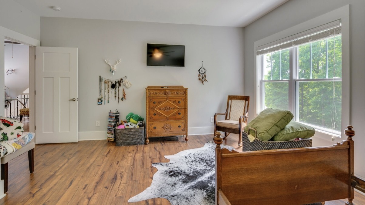 5560 Pinewood Road Franklin, TN 37064 - Photo 27 of 43 a living room with furniture and a flat screen tv