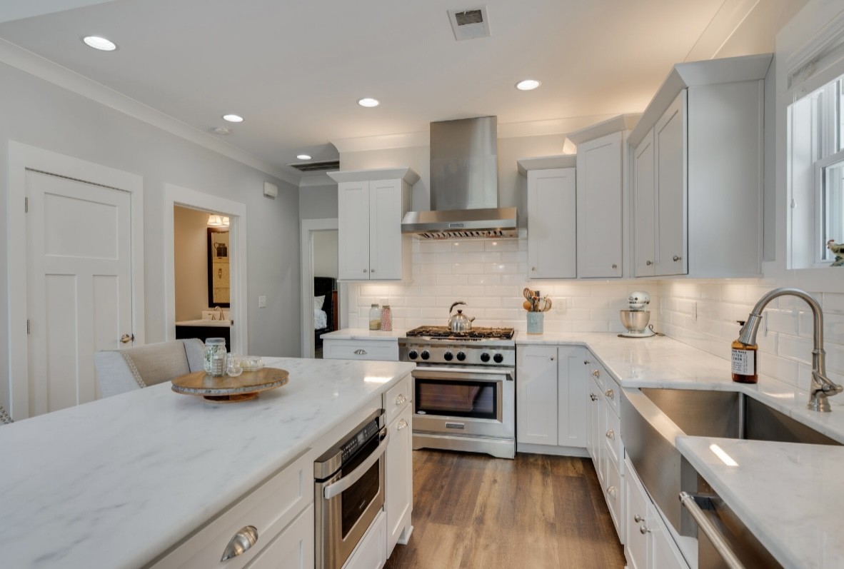 5560 Pinewood Road Franklin, TN 37064 - Photo 9 of 43 a kitchen with a stove sink and cabinets