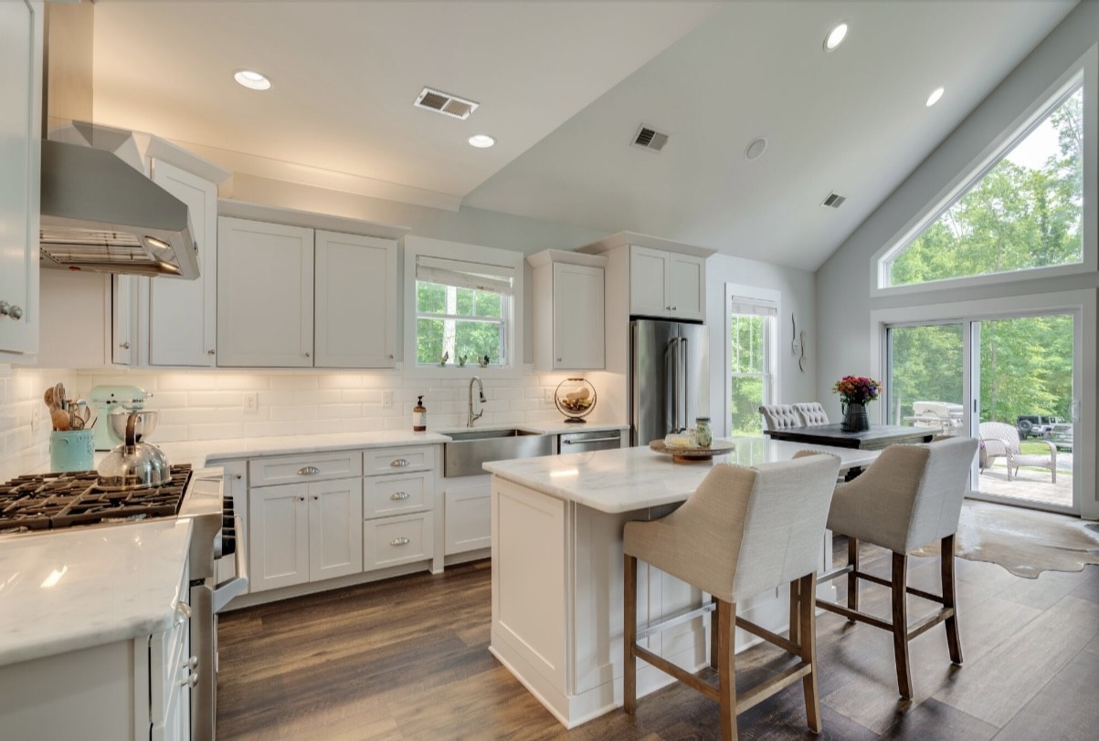 5560 Pinewood Road Franklin, TN 37064 - Photo 10 of 43 a kitchen with sink a stove and chairs