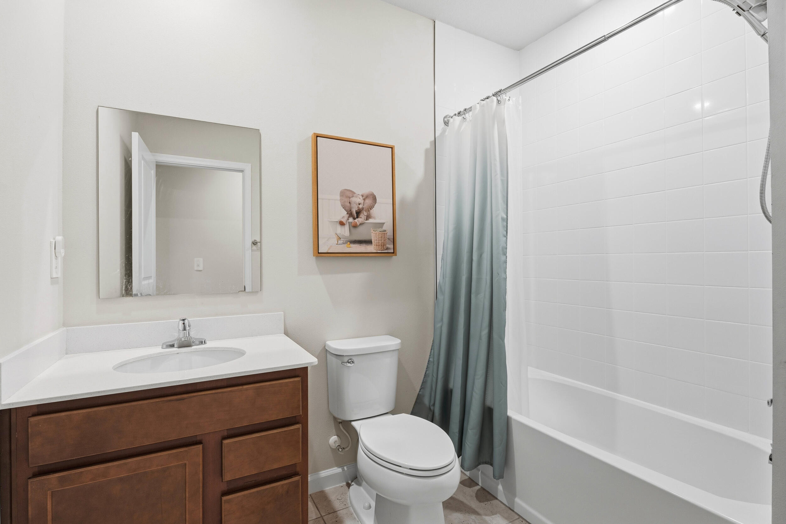 271 Raspberry Road Fort Pierce, FL 34981 - Photo 17 of 42 a bathroom with a sink toilet and shower