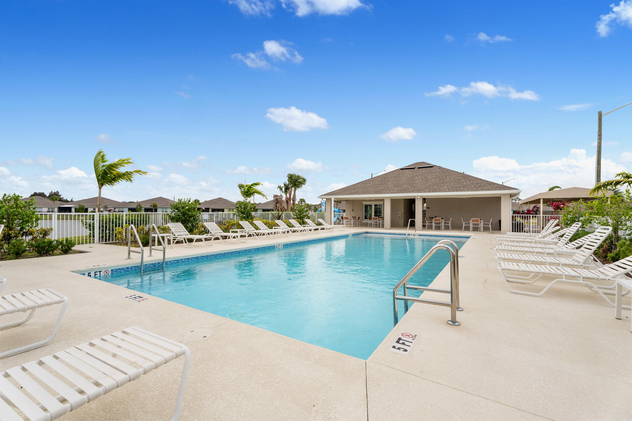 271 Raspberry Road Fort Pierce, FL 34981 - Photo 28 of 42 a front view of a house with swimming pool