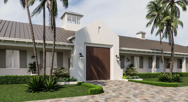 a front view of a house with a yard and potted plants