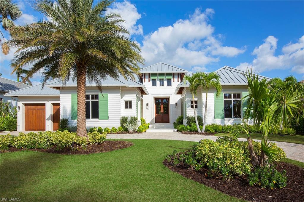 front view of a house with a garden