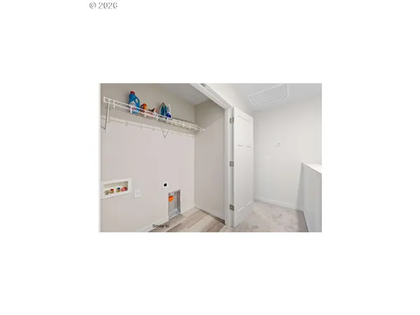 a living room with furniture and a wall painting