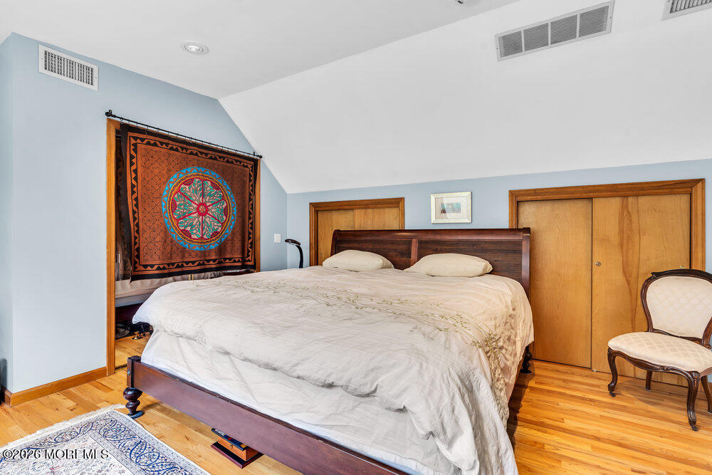 34 State Route Colts Neck, NJ 07722 - Photo 6 of 40 a bedroom with bed and wooden floor