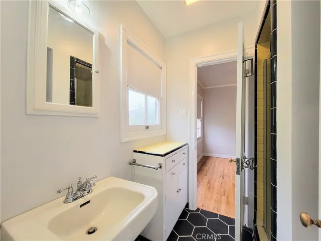 a bathroom with a sink and a mirror