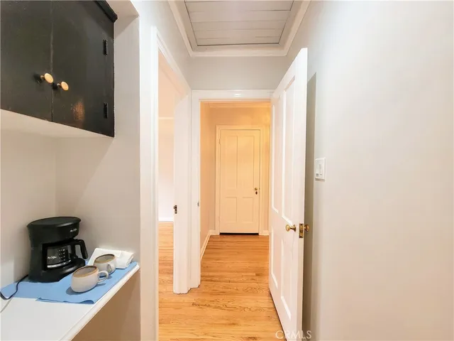 a view of a hallway with hallway and wooden floor