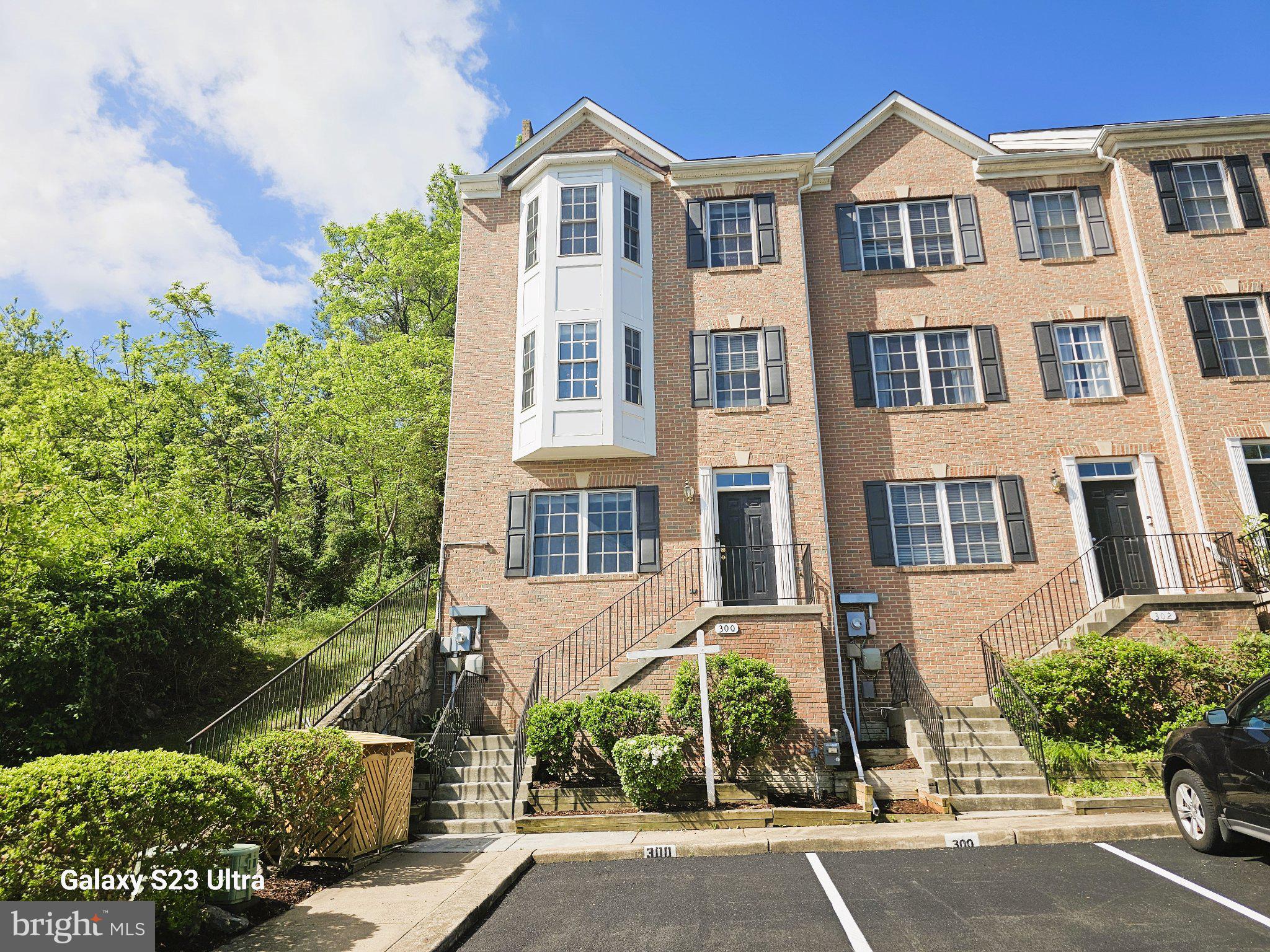 300 Center Lane Occoquan, VA 22125 - Photo 1 of 50 front view of a house with a garden