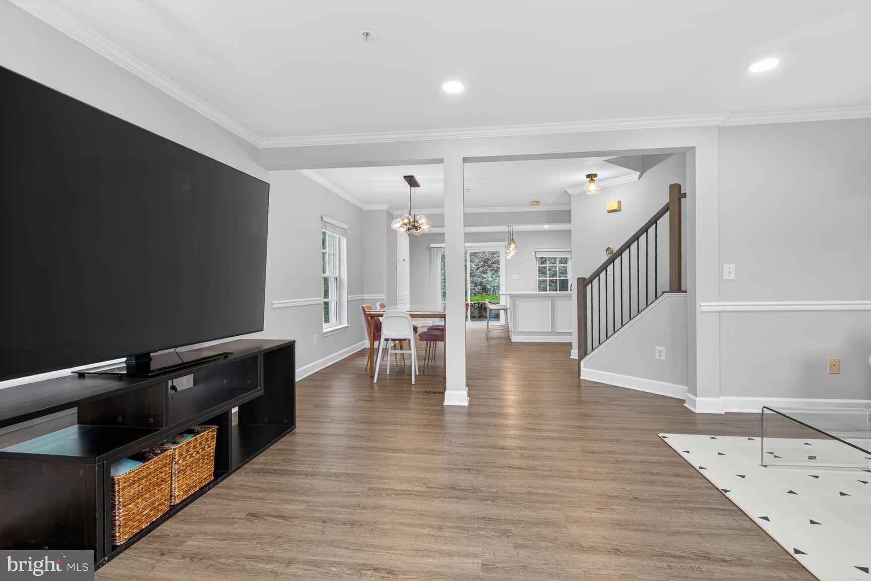 300 Center Lane Occoquan, VA 22125 - Photo 12 of 50 a view of dining room with wooden floor and stairs