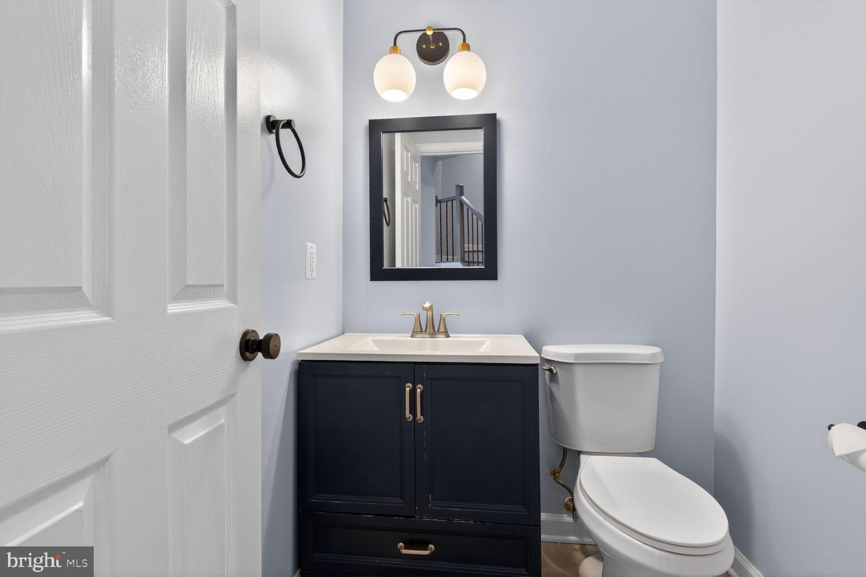 300 Center Lane Occoquan, VA 22125 - Photo 14 of 50 a bathroom with a toilet a sink and mirror