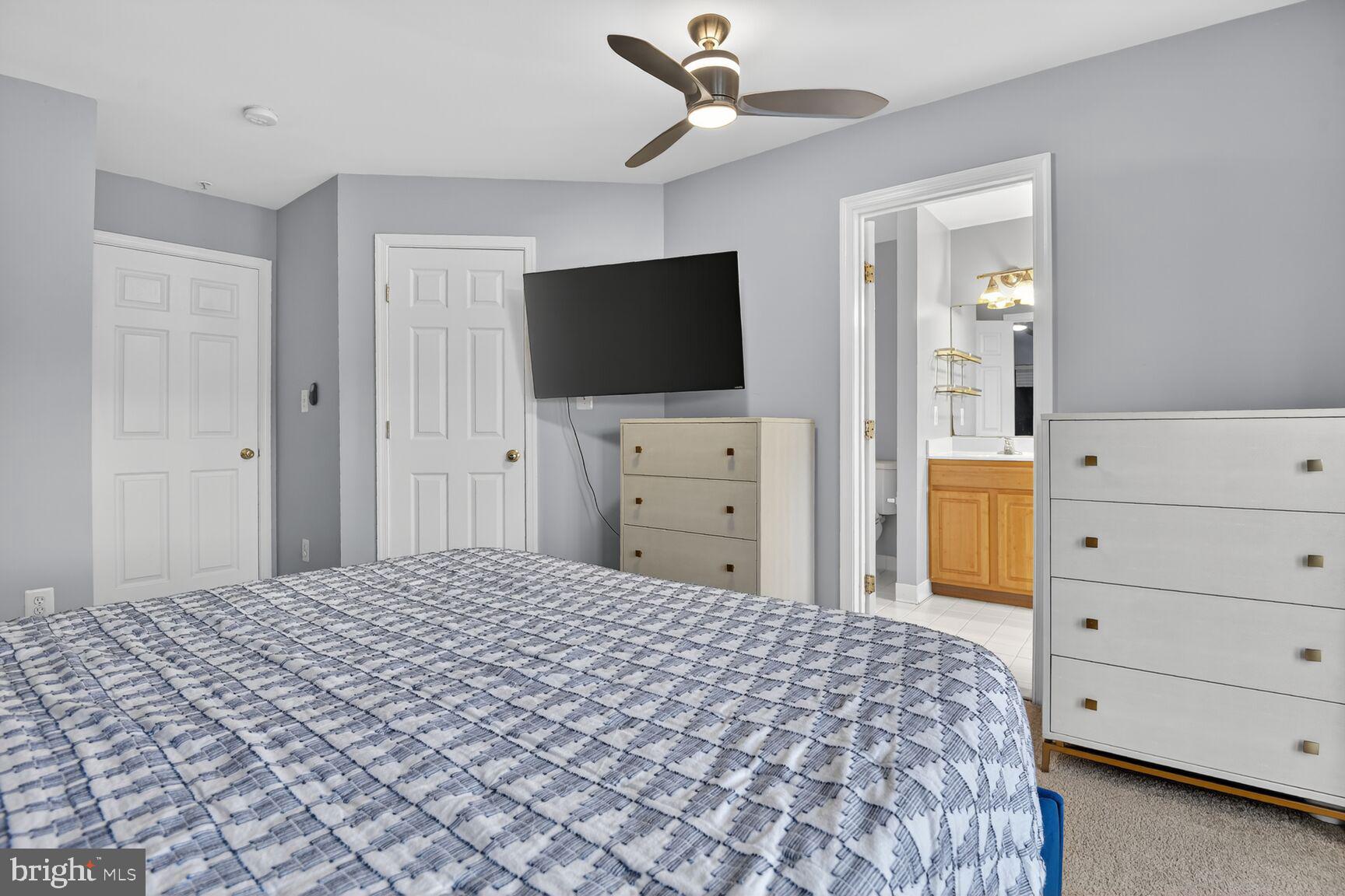300 Center Lane Occoquan, VA 22125 - Photo 17 of 50 a bedroom with a bed and a flat screen tv