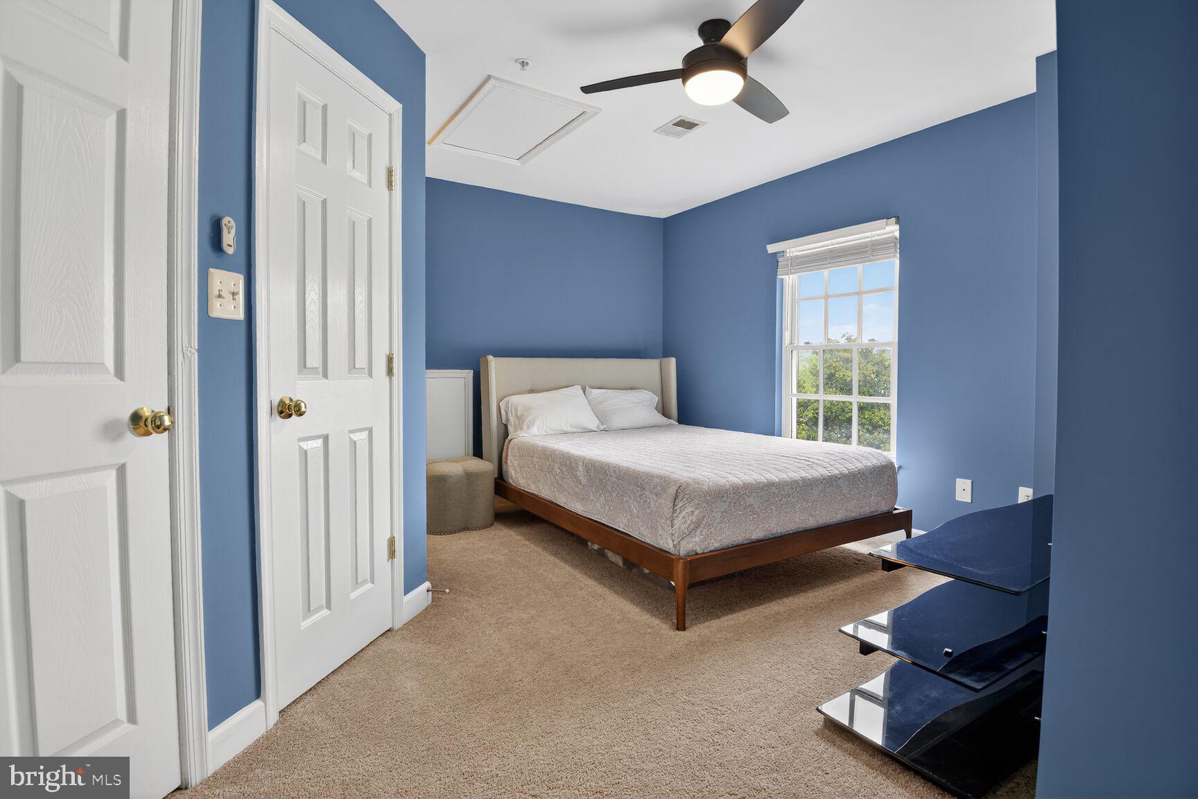 300 Center Lane Occoquan, VA 22125 - Photo 22 of 50 a bedroom with a bed and a chandelier