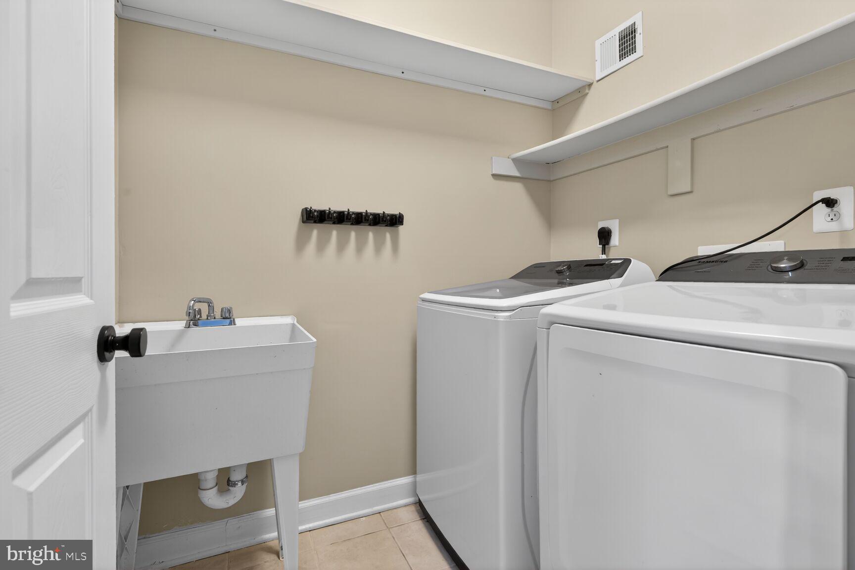 300 Center Lane Occoquan, VA 22125 - Photo 29 of 50 a utility room with dryer and washer