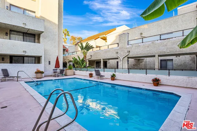 a view of a swimming pool with a patio