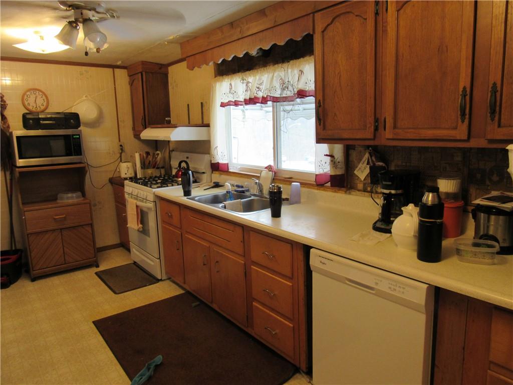 2096 Highway 168 Georgetown, PA 15043 - Photo 2 of 7 a kitchen with a sink cabinets and window