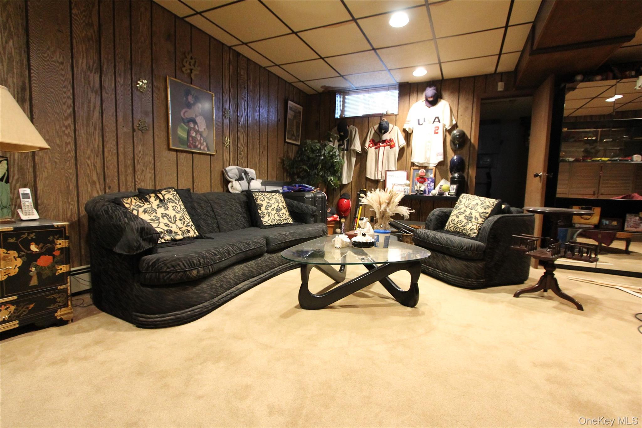 133-28 86th Street Queens, NY 11417 - Photo 11 of 17 a living room with furniture and a couch