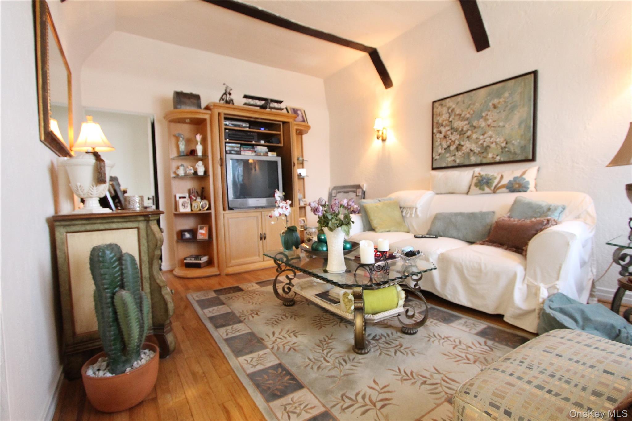 133-28 86th Street Queens, NY 11417 - Photo 3 of 17 a living room with furniture and a fireplace