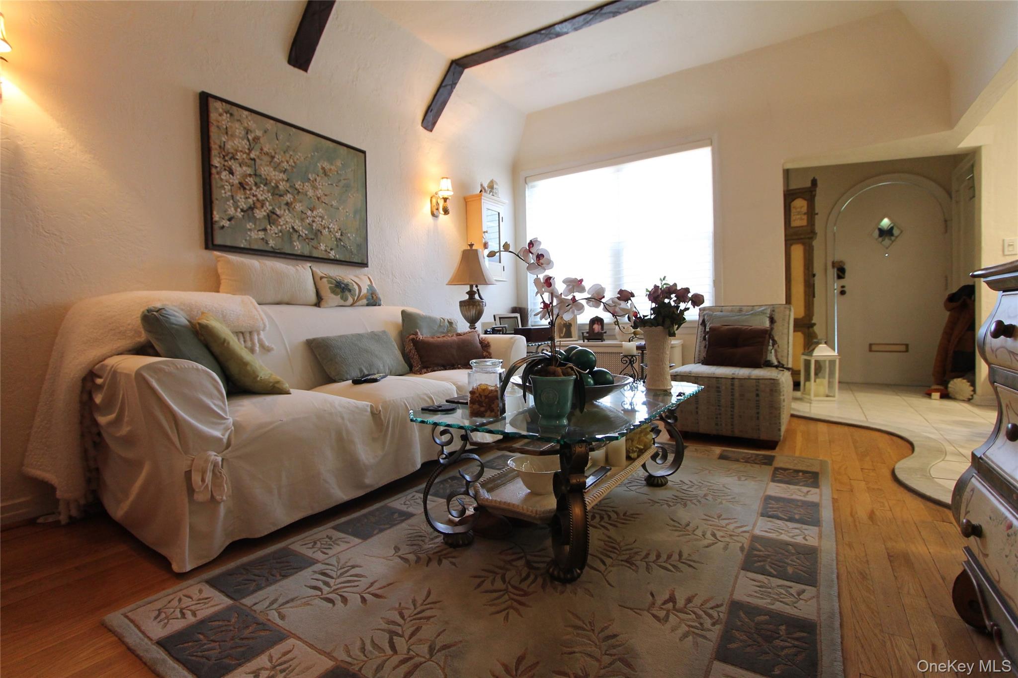 133-28 86th Street Queens, NY 11417 - Photo 4 of 17 a living room with furniture and a large window