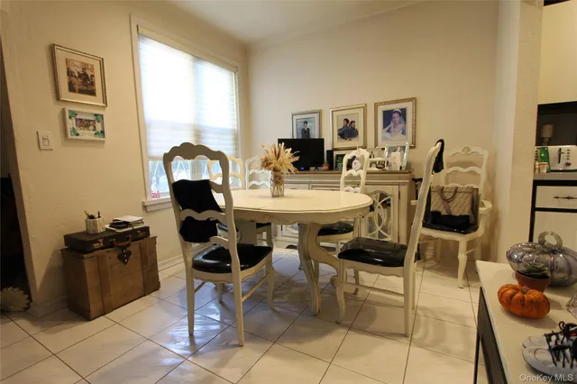 a view of a workspace with furniture and a potted plant