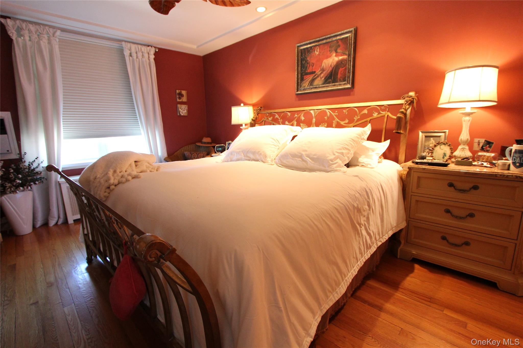 133-28 86th Street Queens, NY 11417 - Photo 9 of 17 a bedroom with a bed and wooden floor