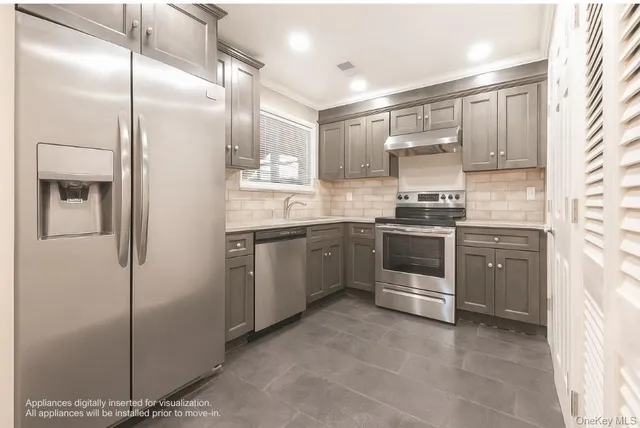 a kitchen with a sink stainless steel appliances and cabinets