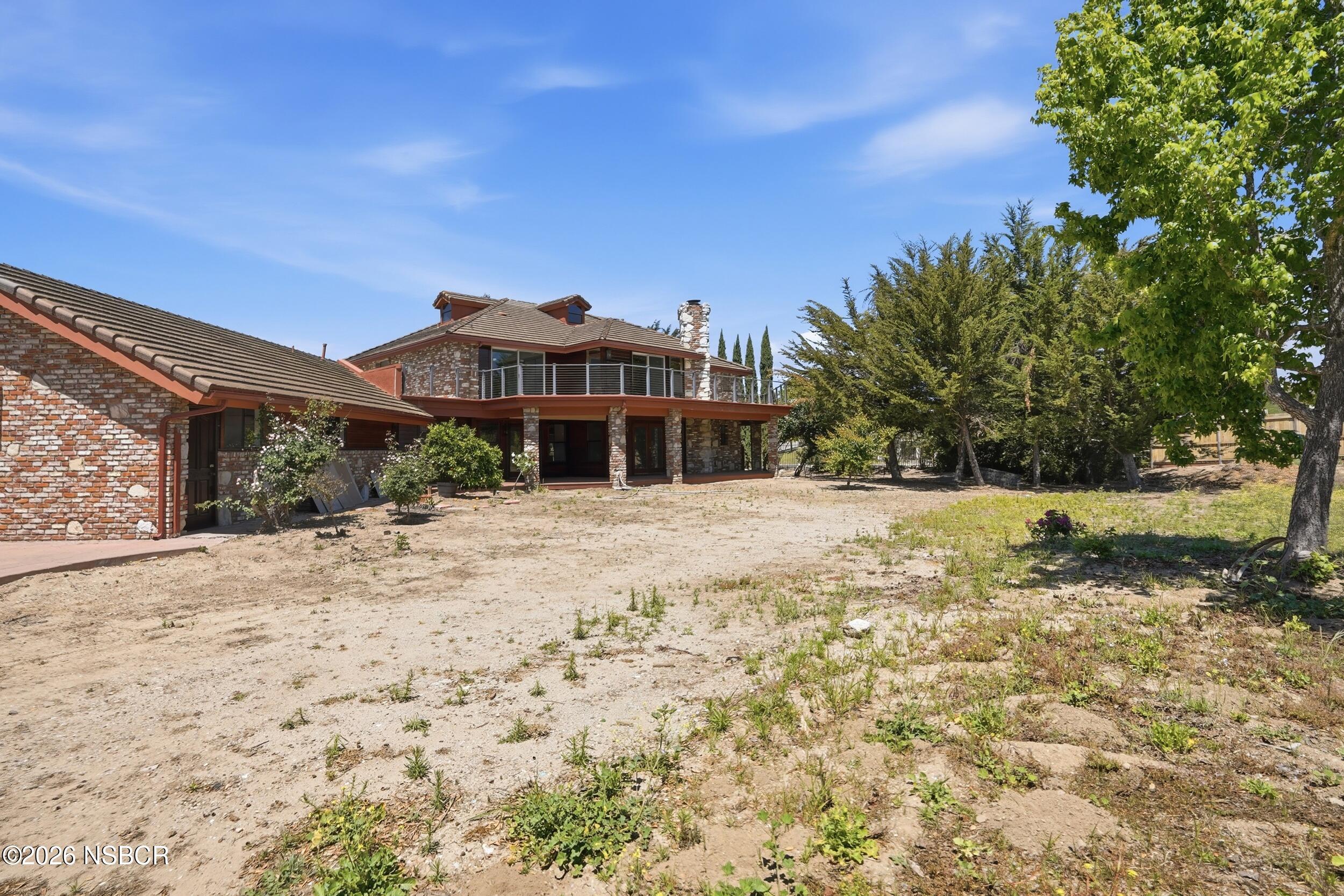 140 East Rice Ranch Road Santa Maria, CA 93455 - Photo 38 of 44 a view of a house with a yard
