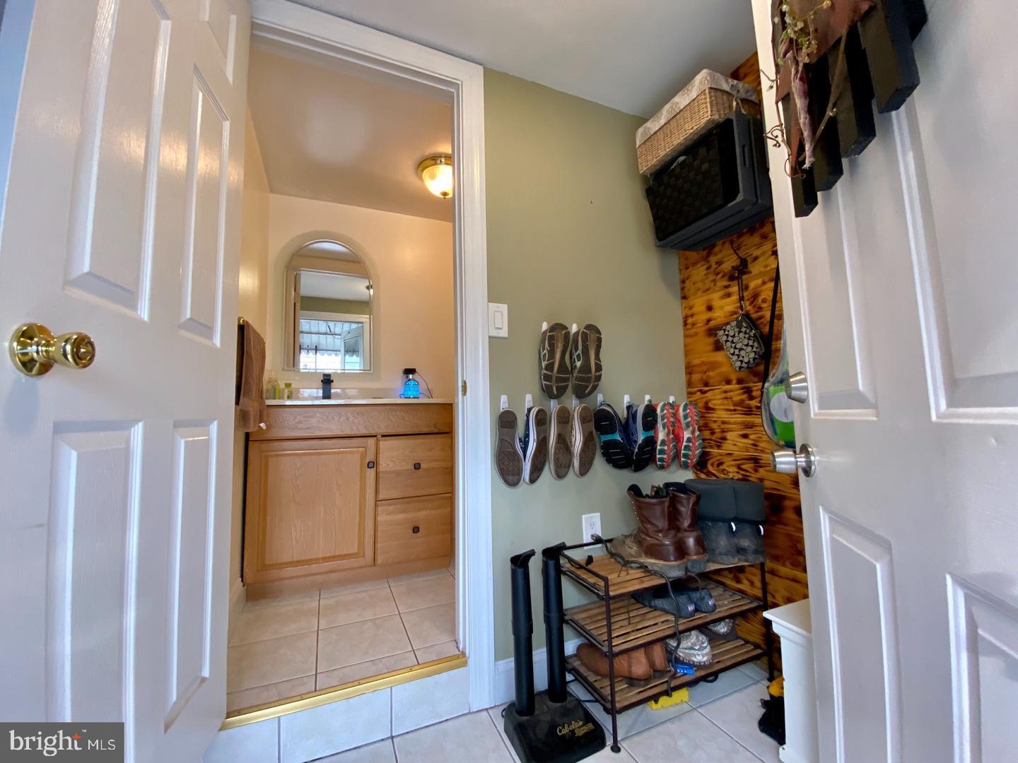 176 Moser Road Pottstown, PA 19464 - Photo 7 of 14 a view of walk in closet with clothes and shoes