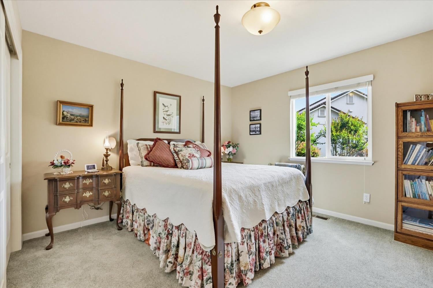 970 Morgan Ranch Drive Grass Valley, CA 95945 - Photo 30 of 76 a bedroom with a bed and a book shelf